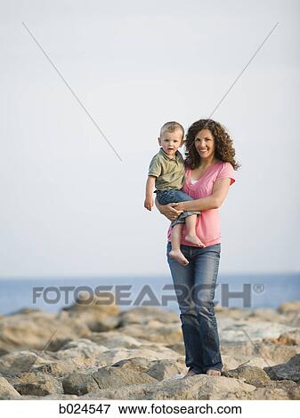 mother and little boy at the beach View Large Photo Image Stock Photo - mother and little boy at the beach. Fotosearch