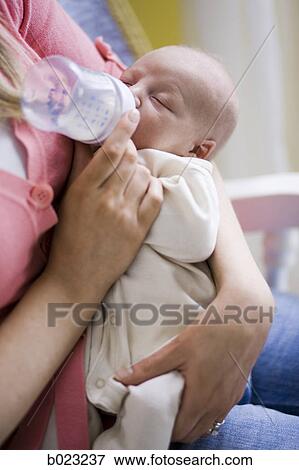 Stock Photo - mother and newborn baby. Fotosearch