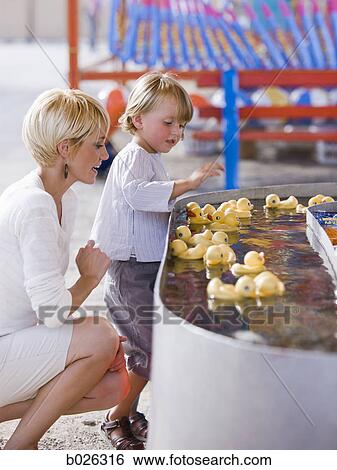 mother and son at a carnival View Large Photo Image Stock Photograph - mother and son at a carnival. Fotosearch