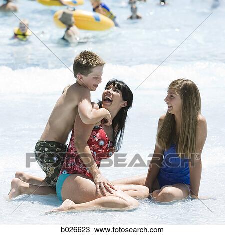mother and two children at a waterpark View Large Photo Image Stock Image - mother and two children at a waterpark. Fotosearch
