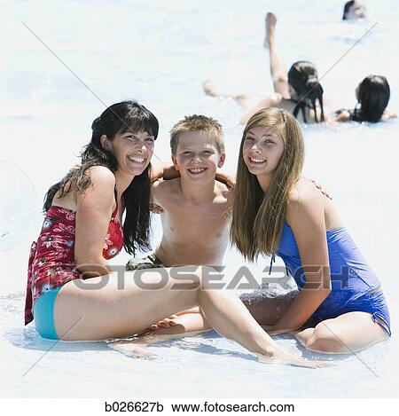 mother and two children at a waterpark View Large Photo Image Stock Image - mother and two children at a waterpark. Fotosearch