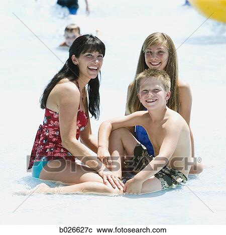 mother and two children at a waterpark View Large Photo Image Stock Image - mother and two children at a waterpark. Fotosearch