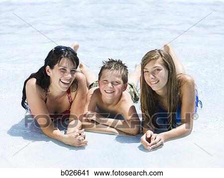 mother and two children at a waterpark View Large Photo Image Stock Image - mother and two children at a waterpark. Fotosearch