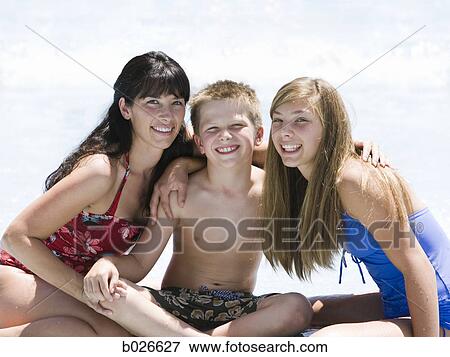 Stock Photo - mother and two children at a waterpark. Fotosearch