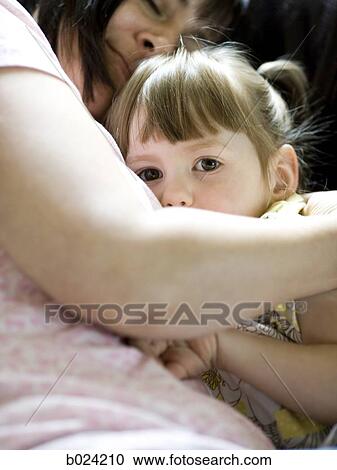 Stock Image - mother holding daughter. Fotosearch