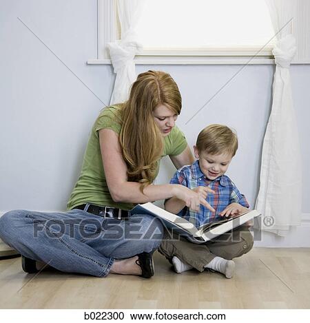 mother reading with child View Large Photo Image Stock Image - mother reading with child. Fotosearch