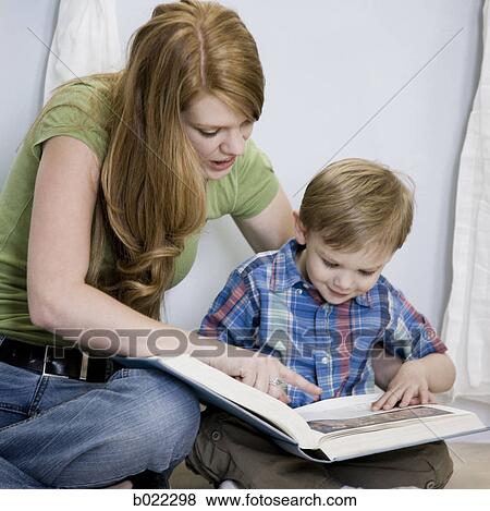 Stock Photo - mother reading with child. Fotosearch