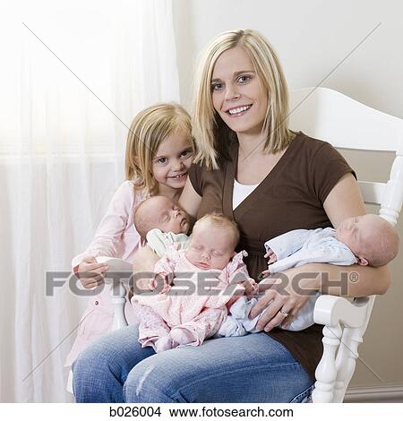 mother with newborn triplets View Large Photo Image Picture - mother with newborn triplets. Fotosearch
