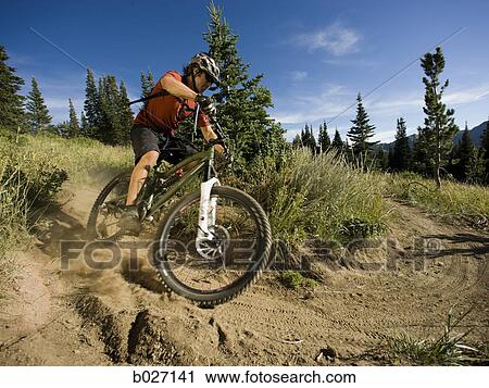mountain biker on a trail View Large Photo Image Stock Image - mountain biker on a trail. Fotosearch