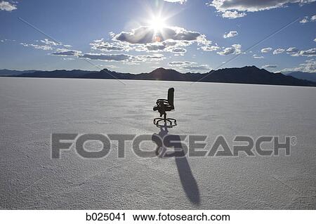 Stock Image - office chair in the middle of nowhere. Fotosearch