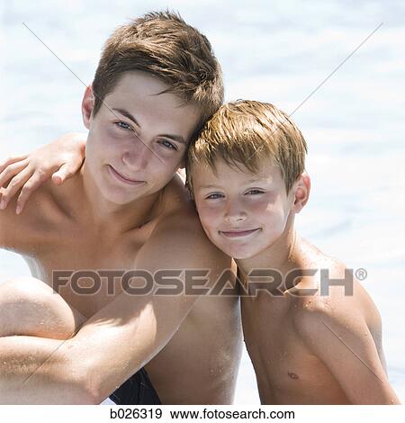 older brother and younger brother at a water park View Large Photo Image Stock Photo - older brother and younger brother at a water park. Fotosearch