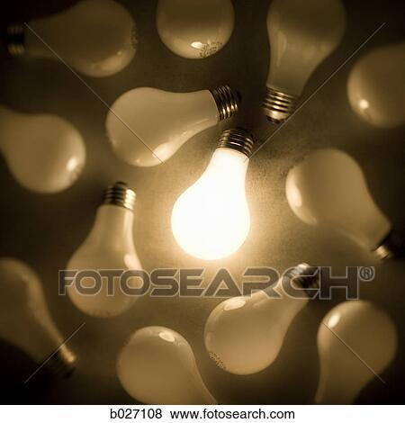 one light bulb lit up among many View Large Photo Image Stock Photo - one light bulb lit up among many. Fotosearch