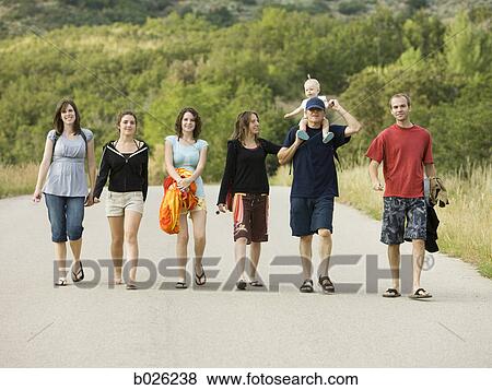 people walking down the road View Large Photo Image Stock Photo - people walking down the road. Fotosearch