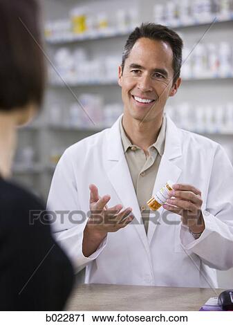 Stock Image - pharmacist at work. Fotosearch