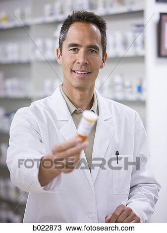 Stock Image - pharmacist at work. Fotosearch