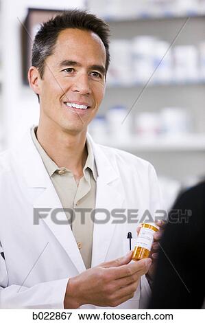 Stock Photo - pharmacist at work. Fotosearch