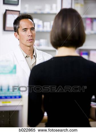 Stock Photography - pharmacist at work. Fotosearch