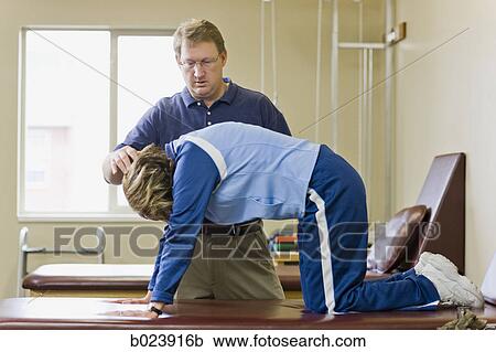 physical therapist working with a woman View Large Photo Image Stock Image - physical therapist working with a woman. Fotosearch