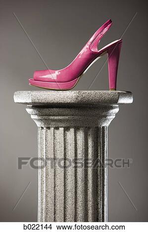 pink high heel shoe on a pedestal View Large Photo Image Picture - pink high heel shoe on a pedestal. Fotosearch