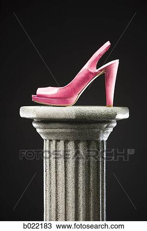 Stock Image - pink high heel shoe on a pedestal. Fotosearch
