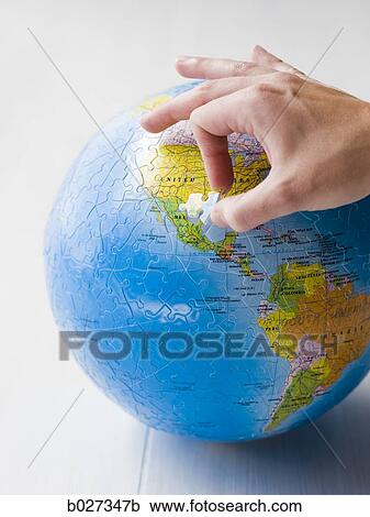 Stock Image - planet earth puzzle. Fotosearch