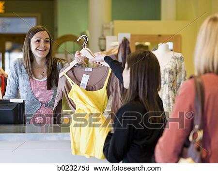 pregnant clothing store clerk View Large Photo Image Stock Image - pregnant clothing store clerk. Fotosearch