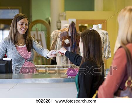pregnant clothing store clerk View Large Photo Image Stock Image - pregnant clothing store clerk. Fotosearch