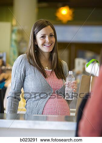 pregnant clothing store clerk View Large Photo Image Stock Image - pregnant clothing store clerk. Fotosearch