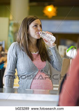 pregnant clothing store clerk View Large Photo Image Stock Photo - pregnant clothing store clerk. Fotosearch