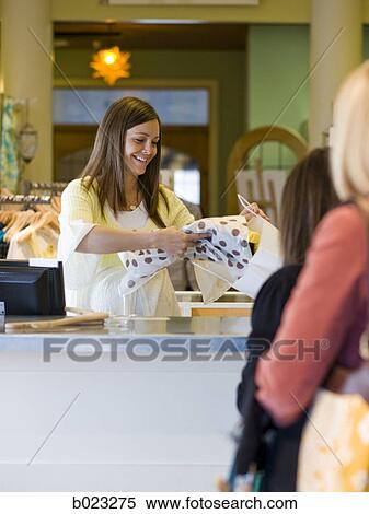 pregnant clothing store clerk View Large Photo Image Stock Photography - pregnant clothing store clerk. Fotosearch