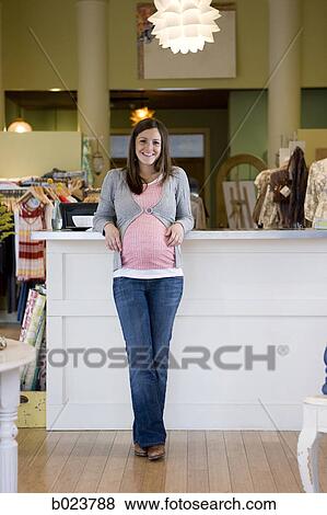 pregnant woman in a store View Large Photo Image Stock Photo - pregnant woman in a store. Fotosearch
