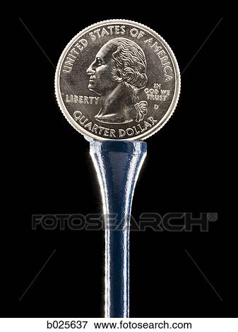 quarter on a golf tee View Large Photo Image Stock Photo - quarter on a golf tee. Fotosearch
