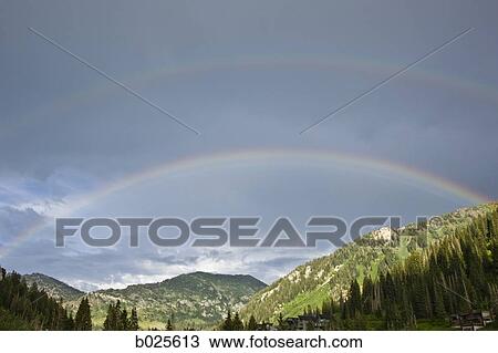 rainbow over a mountain range View Large Photo Image Stock Image - rainbow over a mountain range. Fotosearch