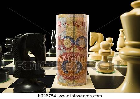 rolled currency on a chess board View Large Photo Image Picture - rolled currency on a chess board. Fotosearch