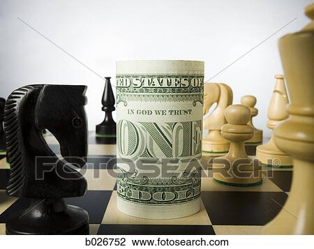 rolled currency on a chess board View Large Photo Image Stock Image - rolled currency on a chess board. Fotosearch