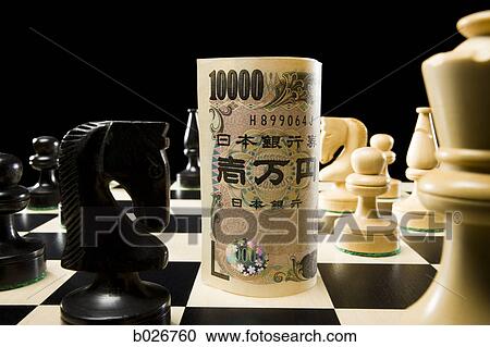 rolled currency on a chess board View Large Photo Image Stock Image - rolled currency on a chess board. Fotosearch