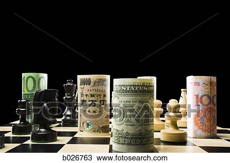 rolled currency on a chess board View Large Photo Image Stock Image - rolled currency on a chess board. Fotosearch