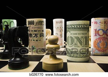 rolled currency on a chess board View Large Photo Image Stock Image - rolled currency on a chess board. Fotosearch