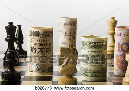 rolled currency on a chess board View Large Photo Image Stock Image - rolled currency on a chess board. Fotosearch