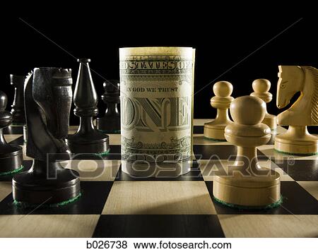 rolled currency on a chess board View Large Photo Image Stock Photo - rolled currency on a chess board. Fotosearch