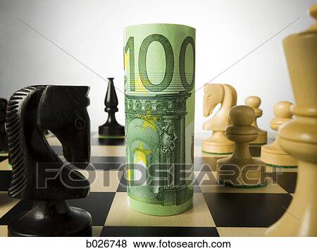 rolled currency on a chess board View Large Photo Image Stock Photo - rolled currency on a chess board. Fotosearch