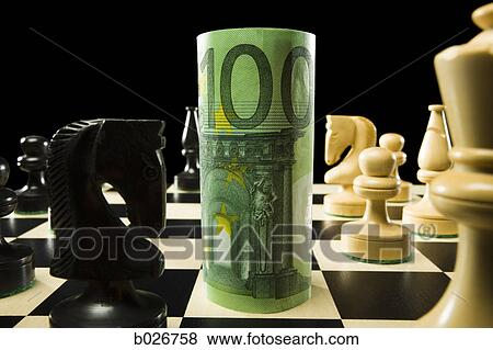 rolled currency on a chess board View Large Photo Image Stock Photo - rolled currency on a chess board. Fotosearch
