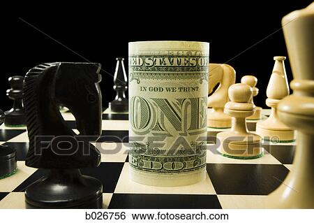 rolled currency on a chess board View Large Photo Image Stock Photograph - rolled currency on a chess board. Fotosearch