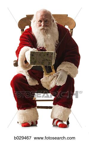 santa claus giving a present View Large Photo Image Stock Photo - santa claus giving a present. Fotosearch