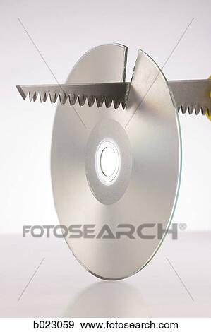 saw cutting a cd View Large Photo Image Stock Photo - saw cutting a cd. Fotosearch