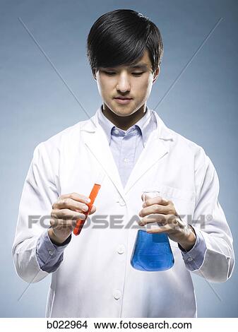 scientist holding test tubes View Large Photo Image Picture - scientist holding test tubes. Fotosearch