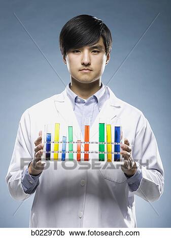 scientist holding test tubes View Large Photo Image Stock Image - scientist holding test tubes. Fotosearch
