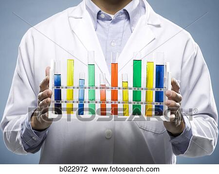 scientist holding test tubes View Large Photo Image Stock Image - scientist holding test tubes. Fotosearch
