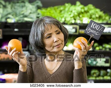 Stock Photography - senior woman at the supermarket. Fotosearch