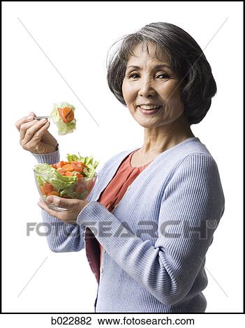 senior woman eating salad View Large Photo Image Stock Image - senior woman eating salad. Fotosearch